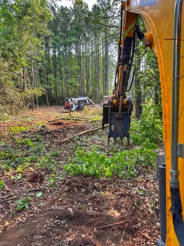 Land clearing and site preparation using excavation and forestry mulching equipment as part of land management services in the South Carolina Lowcountry