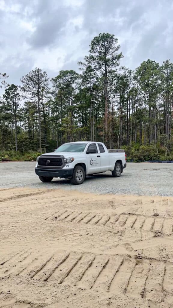 Coastal Survey Co truck parked at a project site during land surveying work